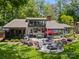 Expansive backyard with a patio, outdoor seating, and lush landscaping at 570 Blue Heron Rd, Salisbury, NC 28146