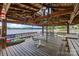 Covered dock featuring ample seating, ceiling fans, and a spiral staircase to the upper level at 570 Blue Heron Rd, Salisbury, NC 28146