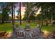 A stunning lake view enjoyed from the paved firepit area with comfortable seating at 570 Blue Heron Rd, Salisbury, NC 28146