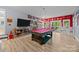 Spacious game room with pool table, flat screen TV, and sports memorabilia at 570 Blue Heron Rd, Salisbury, NC 28146
