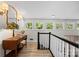 Hallway with charming wood table, stained-glass lamp, and view of exterior scenery at 570 Blue Heron Rd, Salisbury, NC 28146