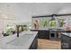 Beautiful kitchen with white countertops, stainless steel appliances, and a view of the lake at 570 Blue Heron Rd, Salisbury, NC 28146