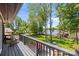 Scenic lake view from a private deck with outdoor seating and mature trees at 570 Blue Heron Rd, Salisbury, NC 28146