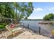 Peaceful lakeside scene with a beach, chaise lounges, and serene water views at 570 Blue Heron Rd, Salisbury, NC 28146