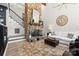 Cozy living room with stone fireplace, plush seating, and view of the staircase at 570 Blue Heron Rd, Salisbury, NC 28146