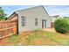 Backyard with sliding glass door and concrete patio at 5804 Fairchase Ave, Charlotte, NC 28269