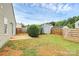 Spacious backyard with a well-maintained lawn, shed, and privacy fence at 5804 Fairchase Ave, Charlotte, NC 28269