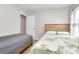 Well-lit bedroom with two beds, wood-look floors, closet and neutral decor at 5804 Fairchase Ave, Charlotte, NC 28269