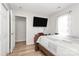 Bedroom featuring hardwood floors, a large window, and an open closet at 5804 Fairchase Ave, Charlotte, NC 28269