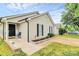 Charming single-story home with light beige siding, black shutters, and well-maintained front yard at 5804 Fairchase Ave, Charlotte, NC 28269