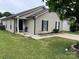 Charming single story home with neutral siding, black shutters, and a well-manicured lawn at 5804 Fairchase Ave, Charlotte, NC 28269