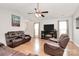 Inviting living room with hardwood floors, vaulted ceiling, and stylish leather furniture at 5804 Fairchase Ave, Charlotte, NC 28269