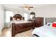Luxurious main bedroom with hardwood floors, large bed, and elegant furniture at 5804 Fairchase Ave, Charlotte, NC 28269