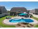 Expansive backyard with a kidney-shaped pool, patio seating, and well-maintained landscaping at 5849 Mcclintock Dr # 117, Denver, NC 28037