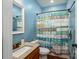 Full bathroom with nautical themed shower curtain and vanity with granite countertop at 5849 Mcclintock Dr # 117, Denver, NC 28037