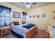 Bright bedroom with large bed, beach decor and natural light at 5849 Mcclintock Dr # 117, Denver, NC 28037