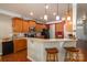 Well-equipped kitchen with a breakfast bar and ample cabinet space at 5849 Mcclintock Dr # 117, Denver, NC 28037