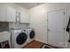 Laundry room with washer, dryer, utility sink and storage cabinets at 5849 Mcclintock Dr # 117, Denver, NC 28037