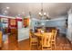 Open concept living space seamlessly connecting the kitchen, dining area, and living room at 5849 Mcclintock Dr # 117, Denver, NC 28037