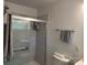 Bright bathroom with sleek glass shower, modern vanity, and neutral wall tile and flooring at 703 S Highway 27 Hwy, Stanley, NC 28164