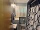 Bathroom with stylish black and white shower curtain, vanity, modern light fixture and tiled floor at 703 S Highway 27 Hwy, Stanley, NC 28164