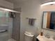 Bright bathroom with sleek glass shower, modern vanity, and neutral wall tile and flooring at 703 S Highway 27 Hwy, Stanley, NC 28164