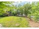 Expansive backyard with mature trees and a charming gazebo at 707 Saint Cloud Dr, Statesville, NC 28625