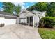 Charming home with white brick, black shutters, and a well-maintained lawn at 707 Saint Cloud Dr, Statesville, NC 28625