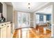 Inviting foyer with hardwood floors, decorative glass front door, and adjacent dining room at 707 Saint Cloud Dr, Statesville, NC 28625