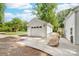 Spacious detached garage with a white door and concrete driveway at 707 Saint Cloud Dr, Statesville, NC 28625
