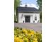 Charming detached garage with black double doors, an American flag, and a classic cupola weather vane at 707 Saint Cloud Dr, Statesville, NC 28625
