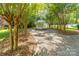 Secluded gazebo surrounded by trees and gravel pathway provides a tranquil retreat at 707 Saint Cloud Dr, Statesville, NC 28625