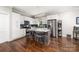 Well-equipped kitchen featuring white cabinets, stainless steel appliances, and a center island with seating at 707 Saint Cloud Dr, Statesville, NC 28625