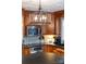This kitchen has granite counters, a stone backsplash, stainless steel appliances, and custom wood cabinets at 707 Saint Cloud Dr, Statesville, NC 28625