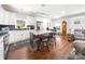 Kitchen with an island, hardwood floors, stainless steel appliances, and white cabinetry at 707 Saint Cloud Dr, Statesville, NC 28625
