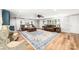 Spacious living room with hardwood floors, neutral walls, and a large area rug at 707 Saint Cloud Dr, Statesville, NC 28625
