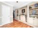 Living room boasts hardwood floors, built-in shelving, and neutral paint at 707 Saint Cloud Dr, Statesville, NC 28625