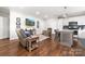 Cozy living room with hardwood floors, modern furniture, and a television on the wall at 707 Saint Cloud Dr, Statesville, NC 28625