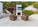 Cozy outdoor fireplace with a mounted TV and comfortable seating provides the perfect spot for relaxation at 707 Saint Cloud Dr, Statesville, NC 28625
