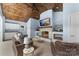 Stylish outdoor living space features a fireplace, TV, and cozy seating, perfect for year-round enjoyment at 707 Saint Cloud Dr, Statesville, NC 28625
