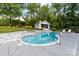 Beautiful pool with a built in jacuzzi, rock waterfall feature, and a nearby pool house at 707 Saint Cloud Dr, Statesville, NC 28625