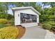 Charming pool house with an outdoor living space, cozy seating, a fireplace, and a mounted TV at 707 Saint Cloud Dr, Statesville, NC 28625