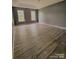 Spacious bedroom featuring modern floors, natural light, and ample space at 716 Coy Ct, Charlotte, NC 28216