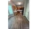 Well-lit kitchen boasts wood cabinets, modern appliances, and wood-look flooring for seamless living at 716 Coy Ct, Charlotte, NC 28216