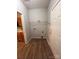 Laundry room with storage shelf, washer/dryer hookups, and convenient access to the kitchen at 716 Coy Ct, Charlotte, NC 28216
