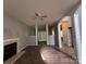 Bright living room with fireplace, ceiling fan, and wood floors create a welcoming and stylish space at 716 Coy Ct, Charlotte, NC 28216