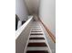 Staircase with wood steps and white risers leading to the upper level of the home at 716 Coy Ct, Charlotte, NC 28216