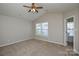 Spacious bedroom featuring a ceiling fan and natural light at 7311 Fig Ln, Charlotte, NC 28215