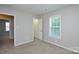 Bedroom featuring carpeted floors, neutral walls and walk-in closet at 7311 Fig Ln, Charlotte, NC 28215