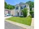 Charming two-story home with a well-manicured lawn, shutters and attached garage at 7311 Fig Ln, Charlotte, NC 28215
